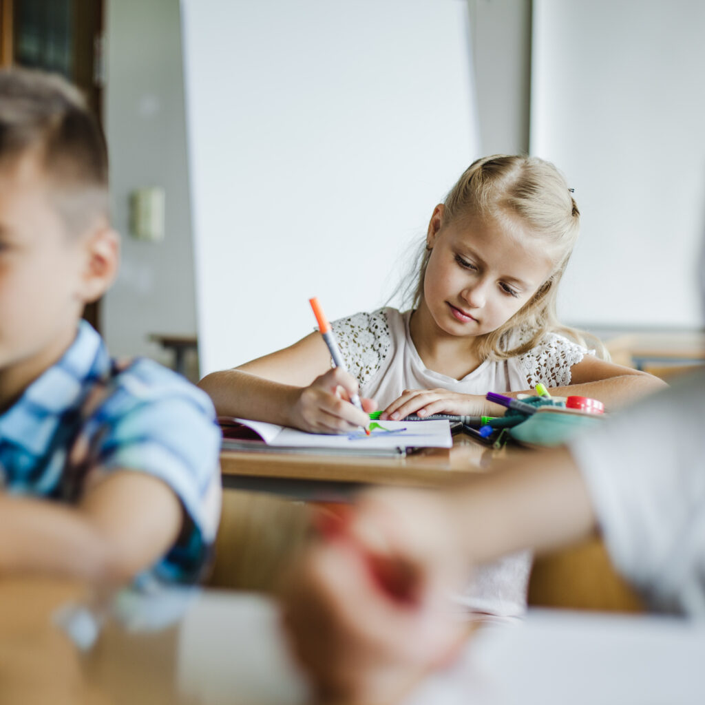 children sitting classroom studying